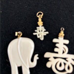 Faux ivory Elephant and Symbol Pendants